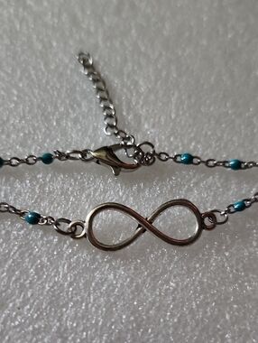 Hand Crafted Silver Infinity Bracelet with Turquoise Accents